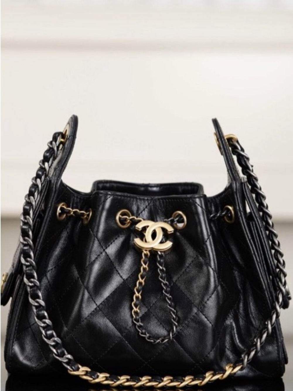 CHANEL Black Quilted Leather Drawstring Bucket Bag with Gold Hardware